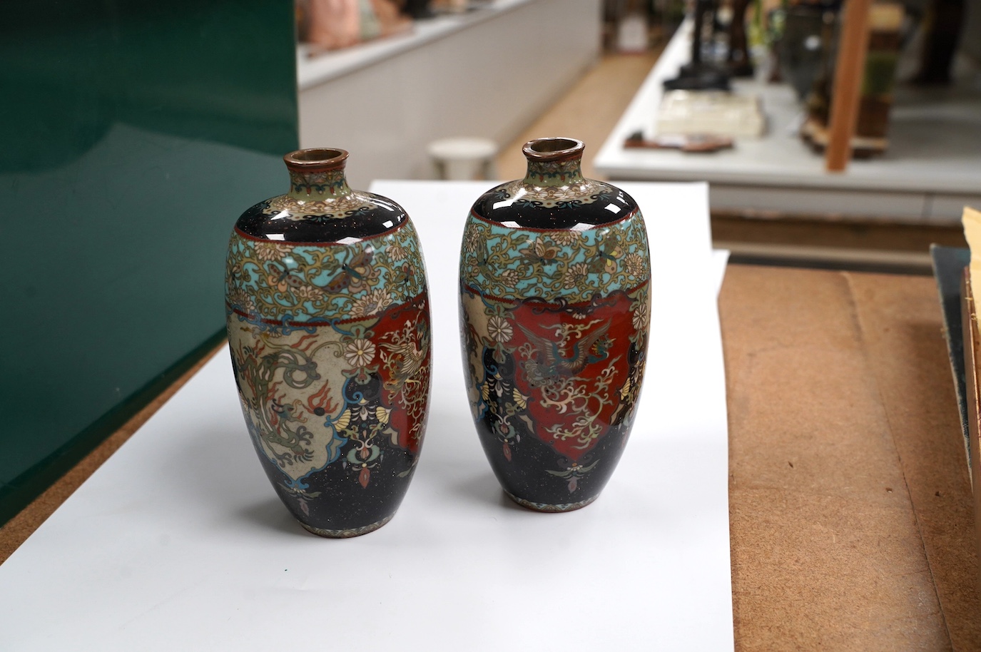 A pair of Japanese cloisonné enamel vases, signed, 14.5cm high. Condition - fair to good